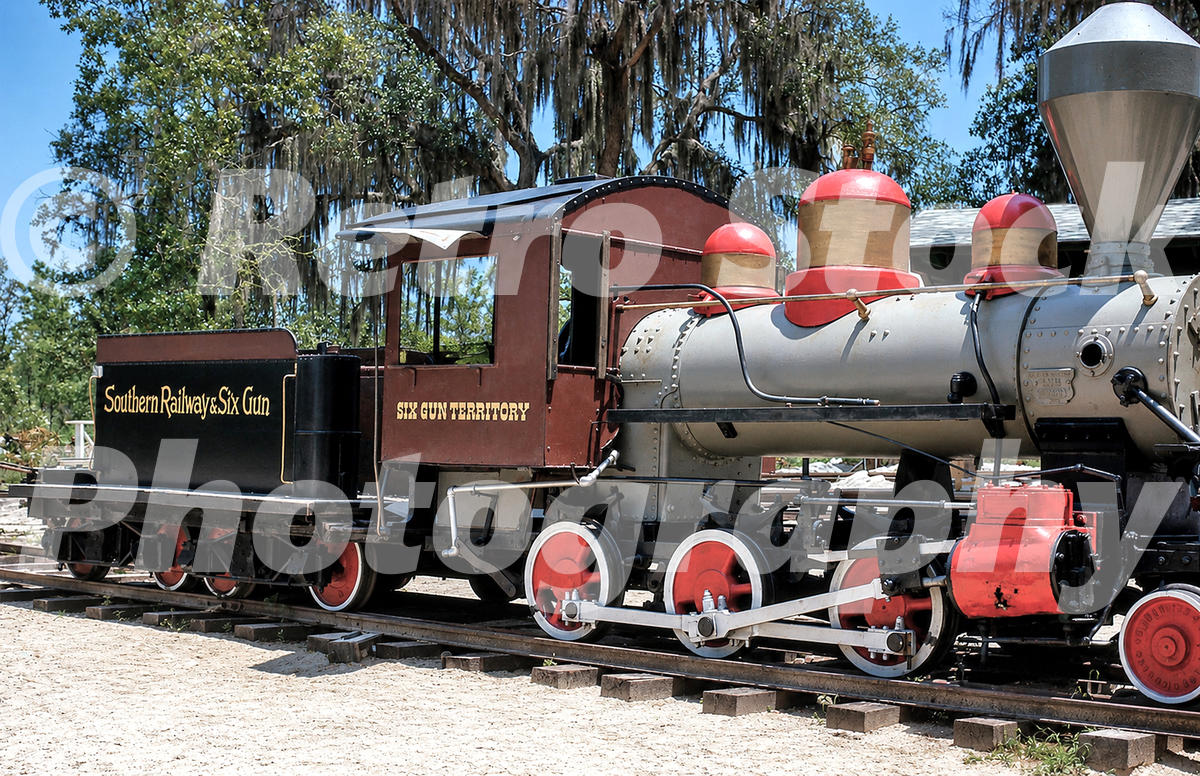 six-gun-territory-silver-springs-florida-1963_55260672441_o 1960s color view of a steam locomotive at Six Gun Territory in Silver Springs, Florida, with Southern Railway & Six Gun lettering and Spanish moss behind.